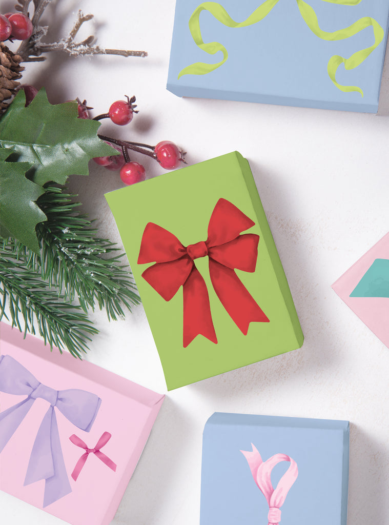 Holiday Ribbons Stickers decorating gift boxes with festive red, pink, and yellow ribbon designs for holiday cheer and wall decor.