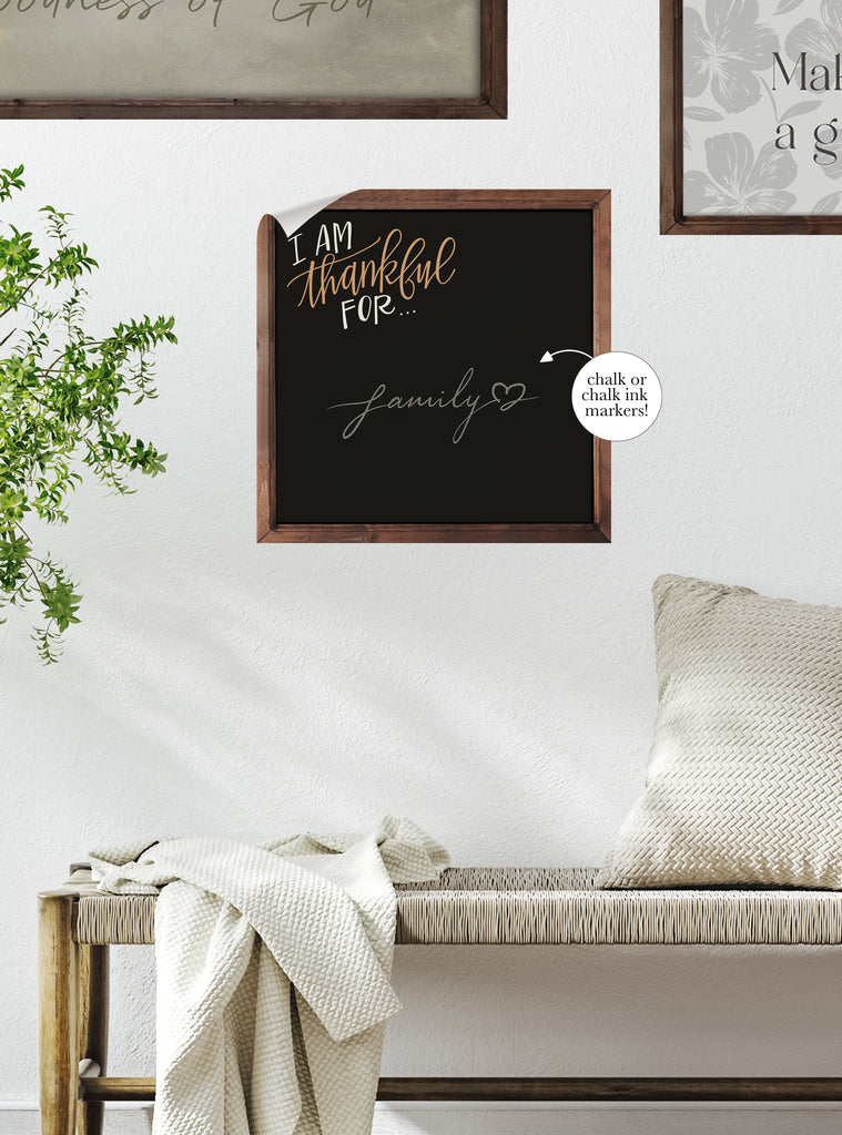 Cozy living space featuring a framed chalkboard wall sticker with motivational wording for daily inspiration and creativity.