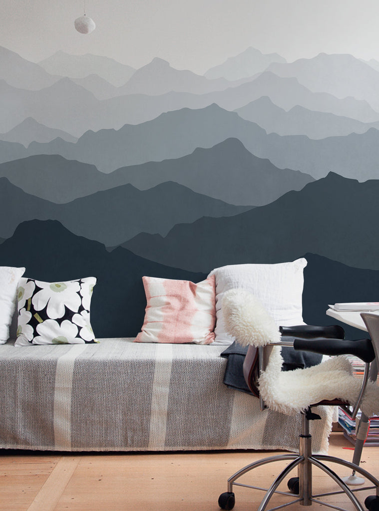 A serene and majestic mountain landscape mural, showcasing layers of hazy silhouettes in shades of gray, creating a sense of depth and expansiveness. This captivating wall art can instantly transform a small space, adding a touch of grandeur and natural beauty, ideal for cozy and modern nurseries, bedrooms, and living rooms. Featured Collection, Top Sellers, Wall Murals, Peel and Stick Wallpaper, Nature Wallpaper, Kids and Baby Nursery Wallpaper,
