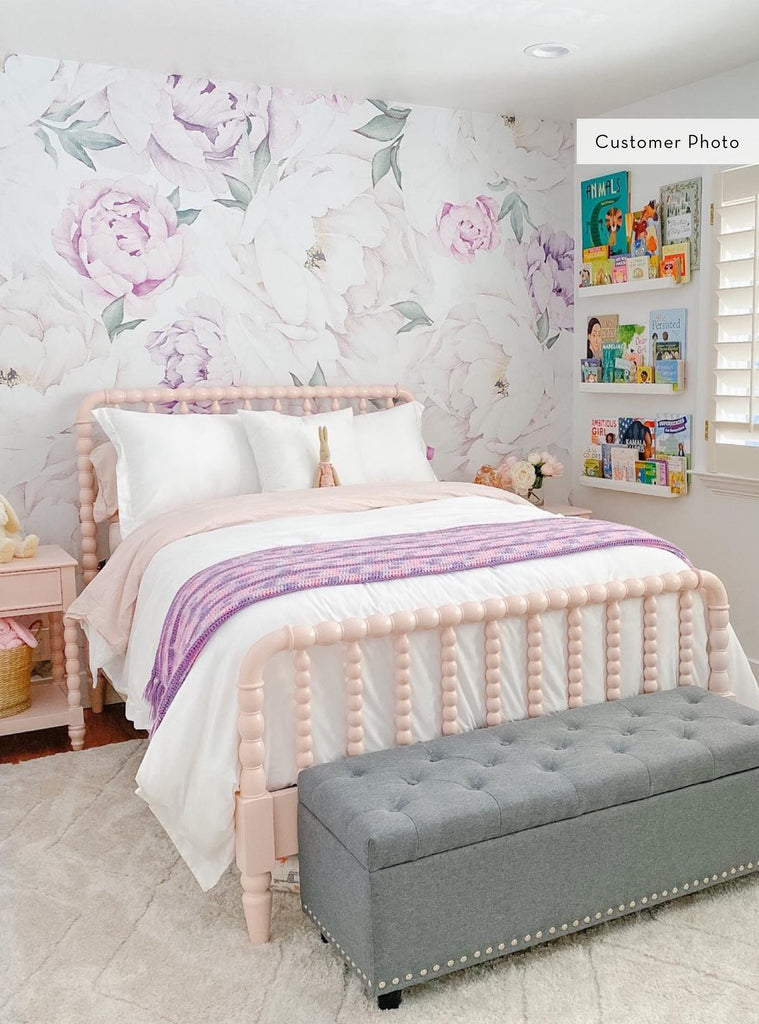Bright bedroom featuring a delicate peony flower mural wallpaper in soft pinks and purples, perfect for kids nursery or girls room decor.