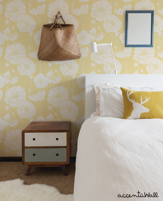 Cozy bedroom corner featuring yellow peony floral wallpaper from the Beige Collection Catalog with modern rustic decor accents