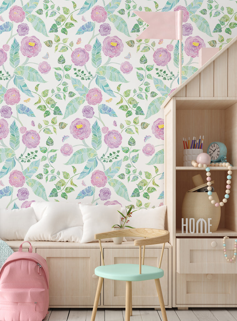 Floral wallpaper with pastel pink flowers and green leaves brightening a cozy kids nursery with light wood furniture and soft cushions