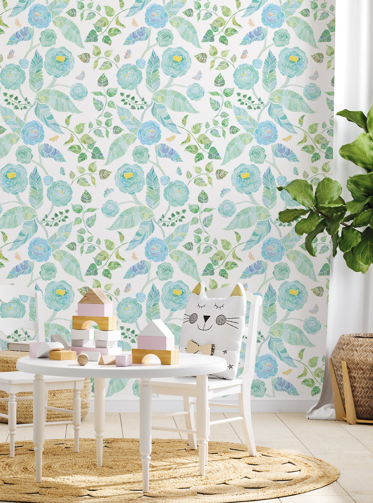 Kids nursery room with pastel floral wallpaper featuring blue flowers and green leaves in a casual, bright setting