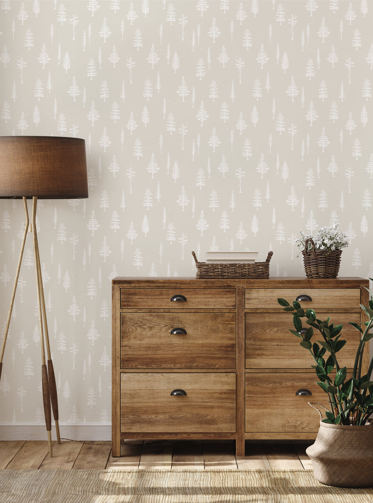 Cozy room featuring Tree With Birds wallpaper in soft beige tones, paired with wooden furniture and natural decor accents