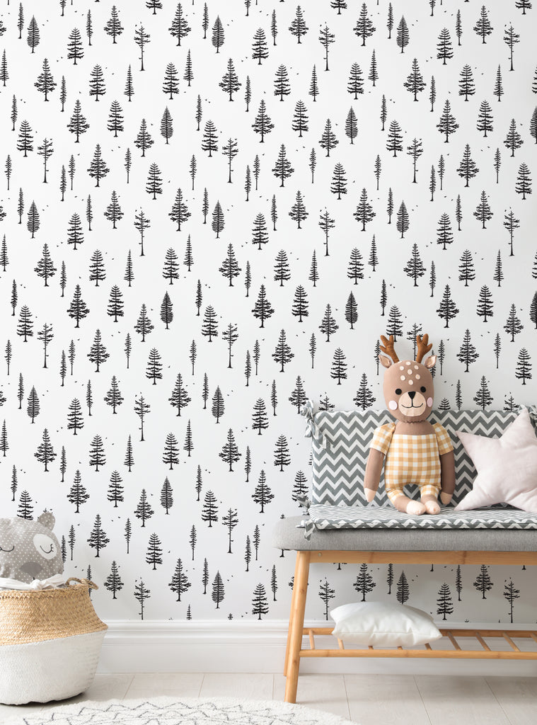 Kids nursery featuring Tree With Birds wallpaper in black and white, cozy decor with plush toys and soft cushions