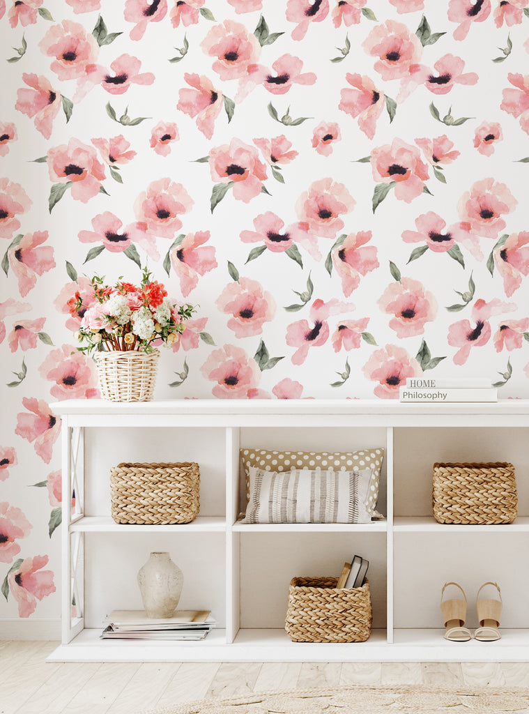 Soft watercolor poppy flowers wallpaper in pastel pink tones adding a delicate floral touch to a cozy living space wall