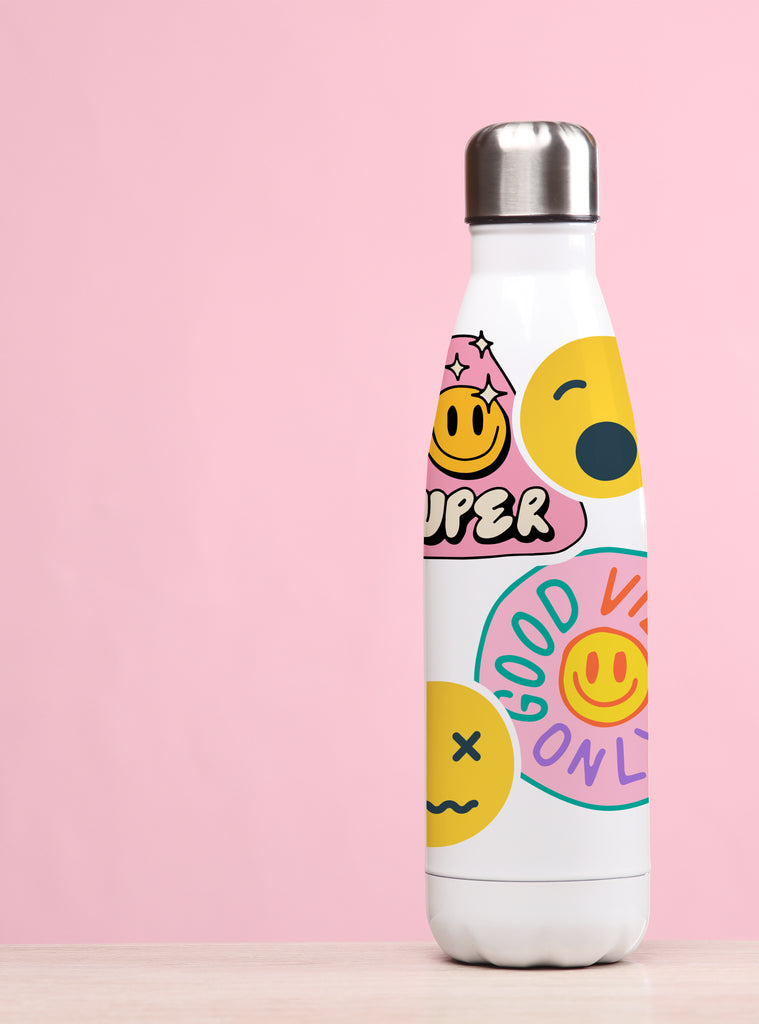 White bottle decorated with colorful emoji stickers expressing various moods and positive phrases on a pink background