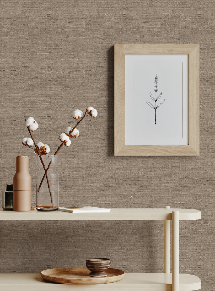 A cozy beige wallpaper setting from the Beige Collection Catalog featuring natural texture with simple rustic decor accents.