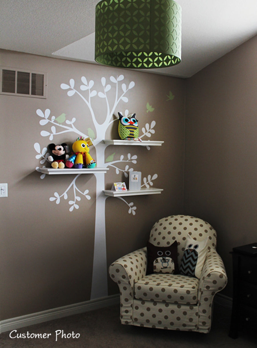 Tree and bird decals with shelves holding toys and stuffed animals against a neutral wall background, Top Sellers,Wall Decals,Animal Decals,Tree Decals,Baby Nursery and Kids Wall Decals,All Products