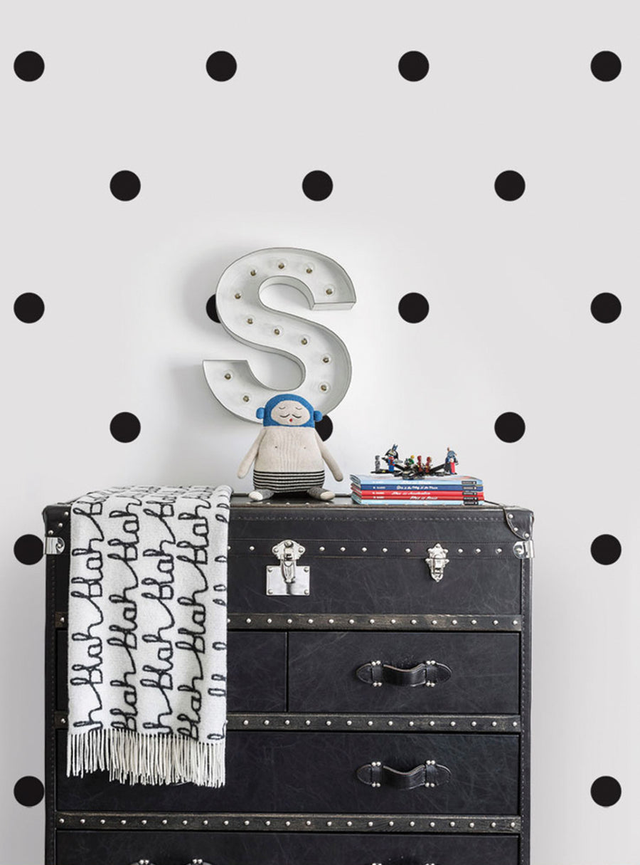 Large polka dots pattern adorns the bright white background, creating a playful and vibrant ambiance. The image showcases a stylish decal or wall art featuring a large letter "S" with illuminated bulbs, perfect for adding a touch of whimsy and personality to any space. This versatile decal can elevate the look of bedrooms, nurseries, playrooms, and more, available in various metallic finishes. , Top Sellers,Wall Decals,Baby Nursery and Kids Wall 