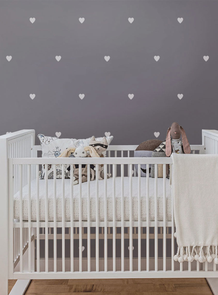 Adorable hearts decorate the wall, adding a whimsical touch to the cozy nursery. The metallic accents and customizable colors make this wall decal a perfect addition to any baby's room, nursery, or playspace. Ideal for bedrooms, nurseries, playrooms, and more, this charming wall decal is a must-have for your little one's space. Top Sellers, Wall Decals, Baby Nursery and Kids Wall Decals, All Products
