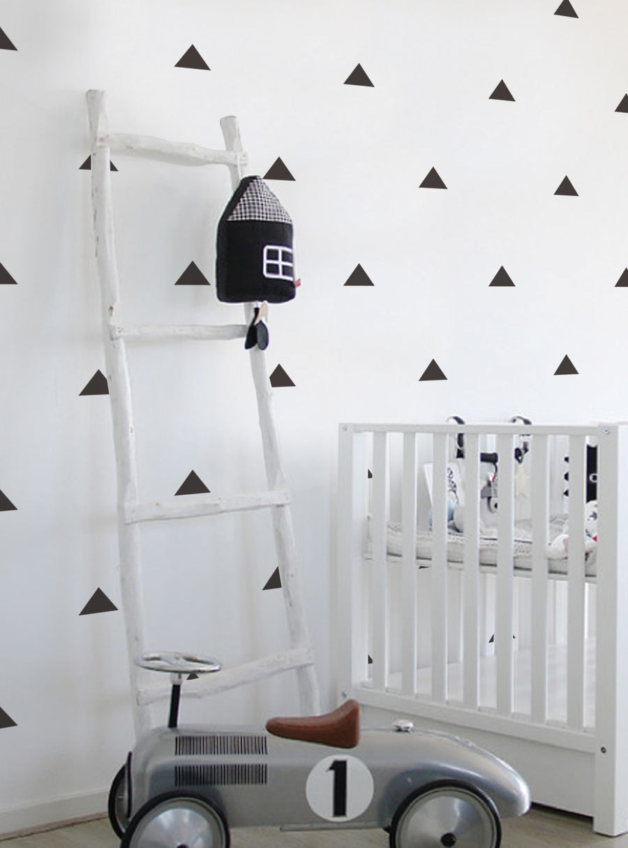 Triangles Wall Decal adds a touch of metallic shine and sparkle to bedrooms, nurseries, playrooms, and more! Available in Gold Metallic, Silver Metallic, or any custom color from our color chart. With (50) 4" Triangles in a single color, this eye-catching wall decal is perfect for creating a modern, geometric accent wall., Top Sellers,Wall Decals,Baby Nursery and Kids Wall Decals,All Products