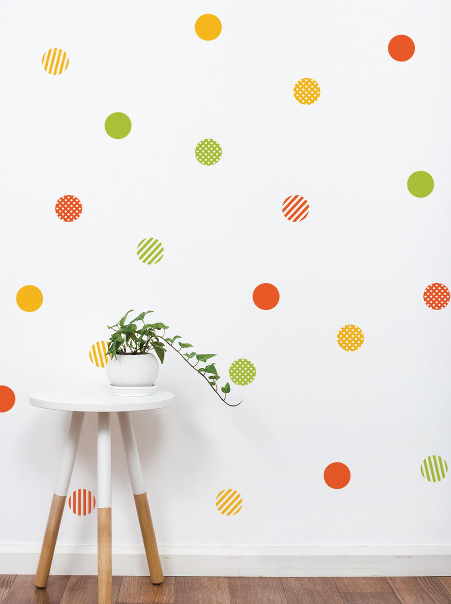 Colorful patterned dots of various sizes and arrangements decorate the wall, creating a vibrant and playful atmosphere. The dots come in a variety of hues, including yellow, orange, green, and red, adding a touch of whimsy and energy to the space. This wall sticker set is a perfect addition to kids' rooms or modern vintage-styled spaces, bringing a sense of fun and creativity. , Top Sellers,Wall Stickers,Pattern Wall Stickers,All Products