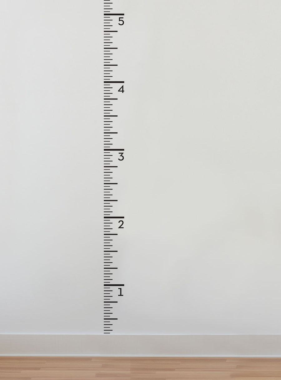 Growth chart ruler with measurements displayed on a wall, perfect for tracking your child's height and growth over time. Versatile wall decal that can be easily applied and removed without damaging the surface. Fun and practical addition to any nursery or child's room. Top Sellers,Wall Decals,Growth Chart Decals,Growth Chart Wall Stickers and Decals,All Products