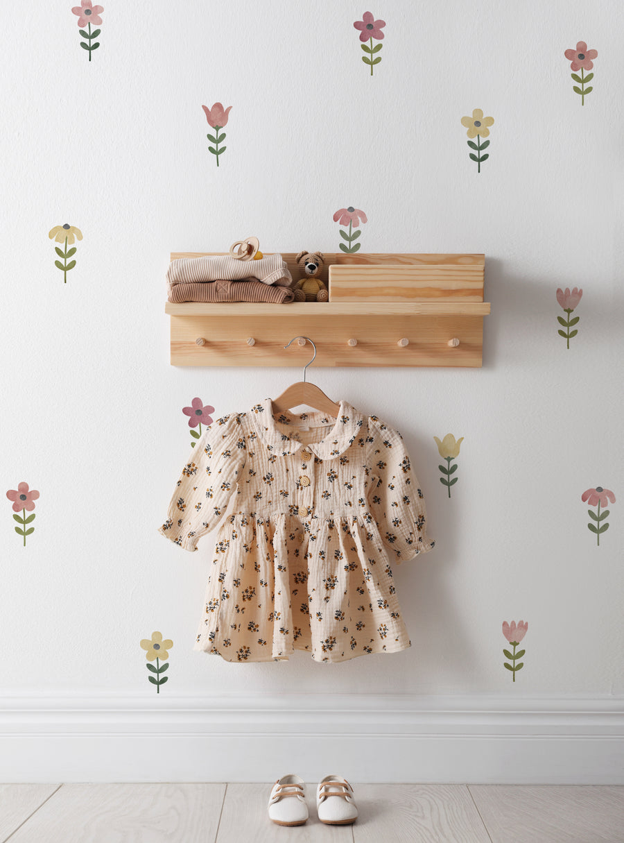Delicate watercolor flowers in soft hues adorn the wall, creating a whimsical and nature-inspired ambiance. This set of Tiny Watercolor Flower Peel and Stick Wall Stickers is perfect for transforming any child's room, playroom, or nursery into a floral oasis. With each flower as its own individual sticker, you and your little one can artfully arrange a charming field of blooms across your walls. Top Sellers,Wall Stickers,Floral Wall Stickers,Natu