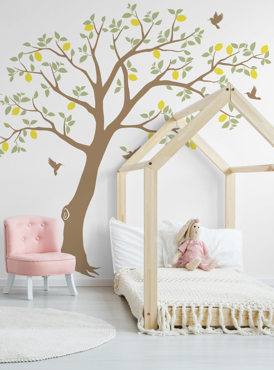 Lush lemon tree with fluttering hummingbirds adorning the wall, creating a tranquil and enchanting atmosphere perfect for a baby nursery or kids room. Customizable colors allow you to seamlessly integrate this charming wall decal into your decor. Featured Collection, Top Sellers, Wall Decals, Baby Nursery and Kids Wall Decals, All Products