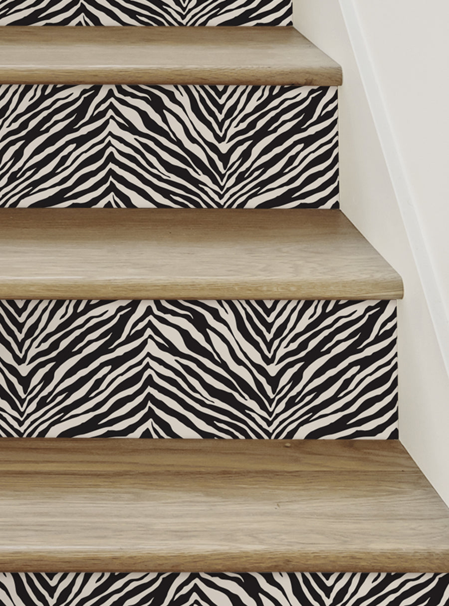Decorative zebra print stair risers add a wild touch of flair to your staircase, featuring bold black and white stripes that evoke the savannah. These repositionable vinyl decals are easy to apply and remove without any mess, allowing you to effortlessly update your space. , Top Sellers,Stair Riser Decals,All Products,Nature and Floral Stair Riser Stickers