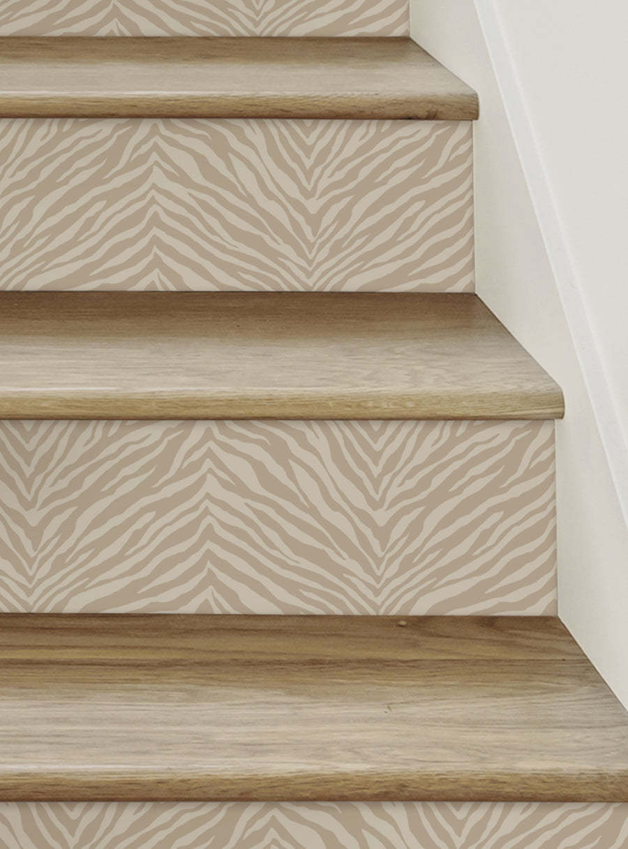 Zebra print patterned vinyl stair riser strips, perfect for adding a wild touch to your staircase. Repositionable and easy to apply, these DIY decals can be reused and repositioned without any mess. Designed and made in New Jersey, this nature-inspired stair decor is a top seller among our Stair Riser Decals and All Products, including our Nature and Floral Stair Riser Stickers.