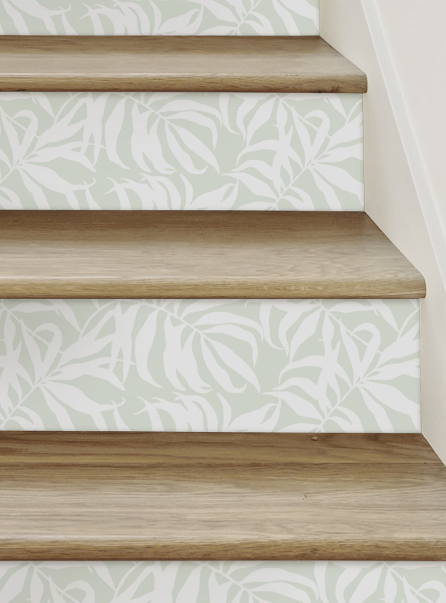 Tropical palm leaves adorn the steps, creating a lush, summery vibe for this Shopify product. The peel and stick stair riser strips feature a nature-inspired design that can be easily installed to transform any staircase. Top Sellers,Stair Riser Decals,All Products,Nature and Floral Stair Riser Stickers