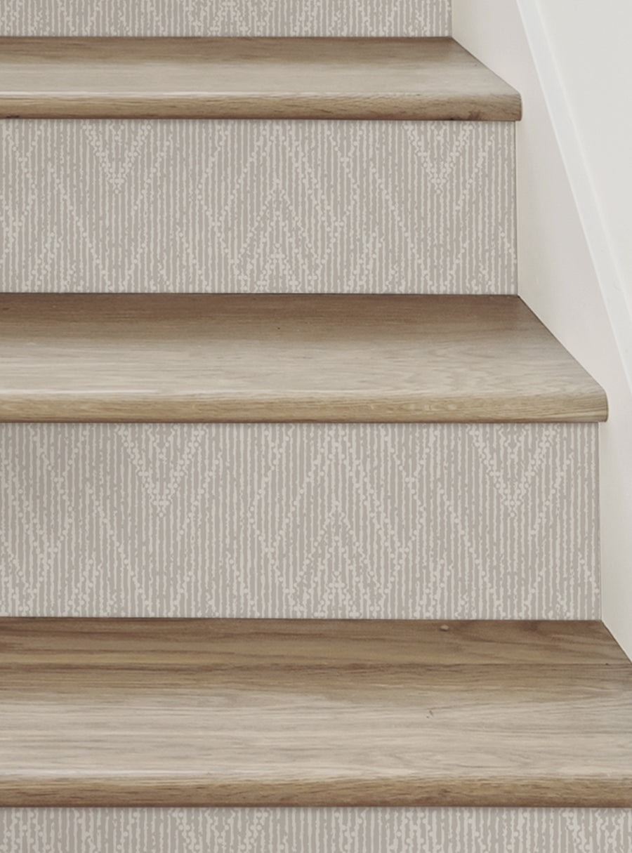 Wooden steps with a woven chevron pattern, creating a handcrafted, textured look for DIY home decor. These Peel and Stick Stair Riser Strips are easily applied and repositioned, making for a hassle-free staircase upgrade. Top Sellers, Stair Riser Decals, All Products, Surface and Texture Look Stair Riser Stickers
