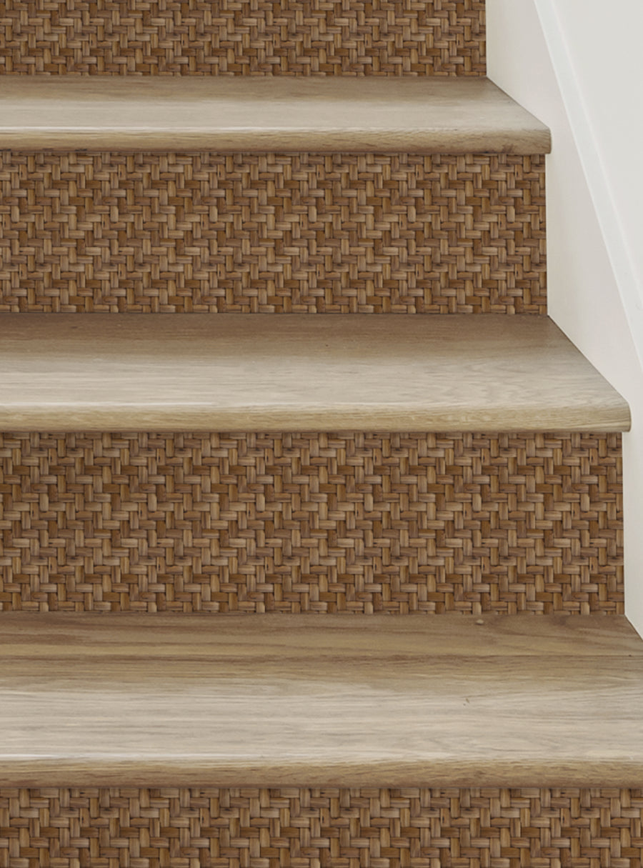 Detailed image of woven wicker pattern on stair risers, showcasing the intricate basket weave design that adds a handmade, artisanal touch to the home. The natural tones and textures create a warm, rustic ambiance, perfect for accenting and enhancing the staircase. Top Sellers, Stair Riser Decals, All Products, Surface and Texture Look Stair Riser Stickers