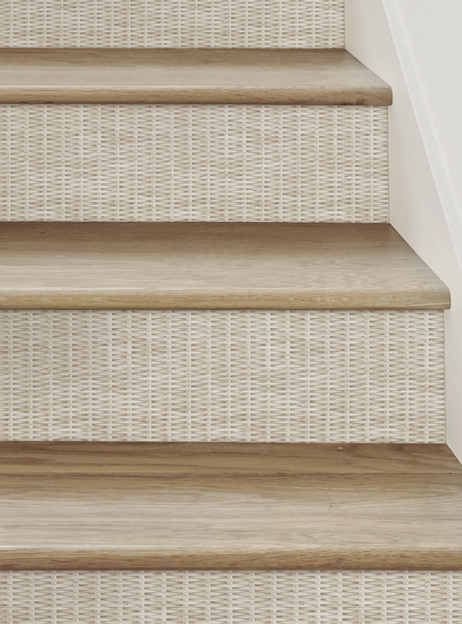 Staircase with a boho-inspired rattan weave pattern on the riser strips, showcasing a natural, handcrafted look and feel. These repositionable, peel-and-stick stair riser decals add an artistic, textured accent to any staircase, perfect for DIY home decor projects. , Top Sellers,Stair Riser Decals,All Products,Surface and Texture Look Stair Riser Stickers