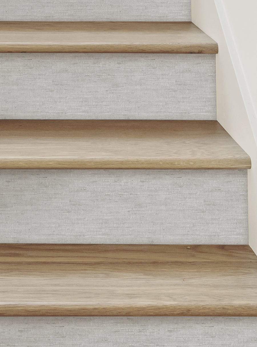 Canvas Look Peel and Stick Stair Riser Strips - Rustic wood-look stair treads with a soft, felt-like texture creating a unique and creative canvas for your DIY home decor project. These versatile, repositionable vinyl stair riser stickers are available in multiple colors to perfectly accent your space. Top Sellers,Stair Riser Decals,All Products,Surface and Texture Look Stair Riser Stickers
