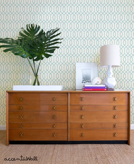 Decorative and stylish geometric hexagon wallpaper in a modern living space, featuring lush tropical plant decor and a vintage wooden dresser, Top Sellers,Peel and Stick Wallpaper,Geometric & Pattern Wallpaper,All Products,Unpasted Wallpaper,Wallpaper and Murals, W9190-DuskyMint-Sample-Vinyl, W9190-DuskyMint-Sample-Fabric, W9190-DuskyMint-Sample-Unpasted