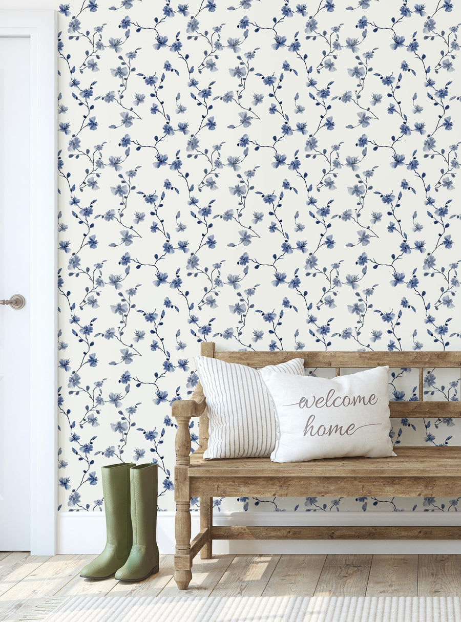 A vibrant, delicate pattern of blue floral vines and leaves adorns this Shopify product's wallpaper, creating a timeless and nature-inspired aesthetic perfect for any room. The removable, peel-and-stick design offers an easy and mess-free application for DIY home makeovers. Top Sellers,Peel and Stick Wallpaper,Floral Wallpaper,Nature Wallpaper,Kids and Baby Nursery Wallpaper,All Products,Unpasted Wallpaper,Wallpaper and Murals