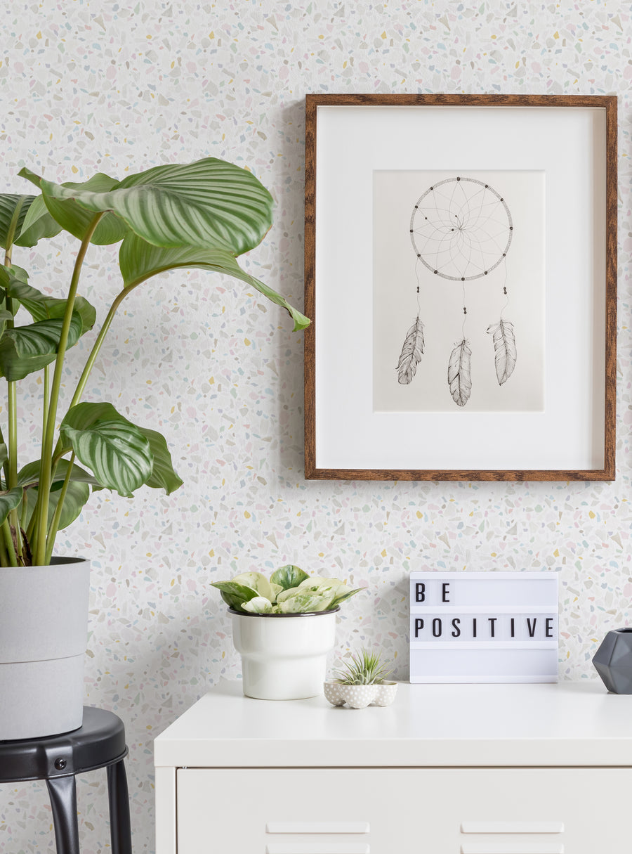 Detailed image of a Terrazzo-patterned wallpaper with organic textures and shapes, featuring a framed dreamcatcher illustration, houseplants, and a "Be Positive" sign - perfect for a cozy, natural-inspired home decor setting., Top Sellers,Peel and Stick Wallpaper,Surface & Texture Wallpaper,Geometric & Pattern Wallpaper,Kids and Baby Nursery Wallpaper,Abstract Murals and Wallpaper,All Products,Unpasted Wallpaper,Wallpaper and Murals