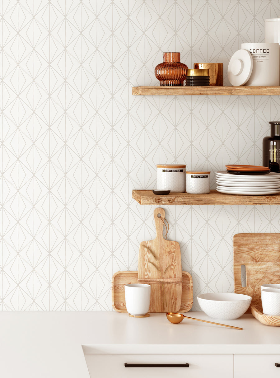 Description of the image: The image shows a modern, well-organized kitchen interior. The background features a geometric patterned wallpaper in a neutral color scheme. On the shelves, there are various kitchen items such as ceramic bowls, plates, and decorative vases in earthy tones. The wooden cutting board and utensils add a natural, rustic touch to the space. Overall, the image conveys a cozy and stylish kitchen aesthetic.

Alt text: Chic kitc